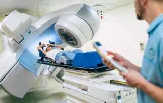 Radiation therapy machine with technician and patient